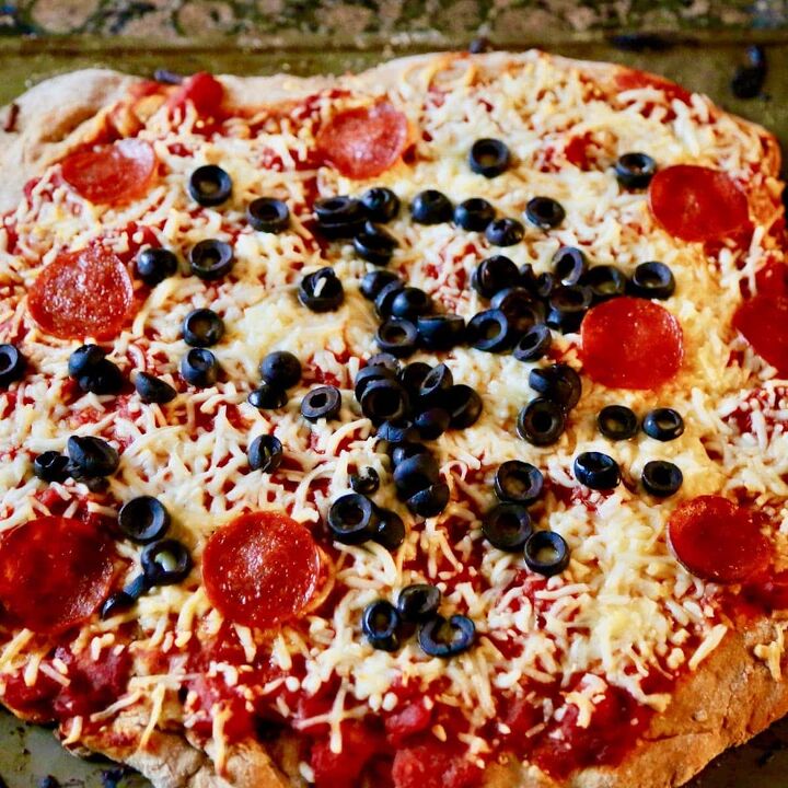fresh pizza dough with whole wheat flour, pizza with pepperoni and olives