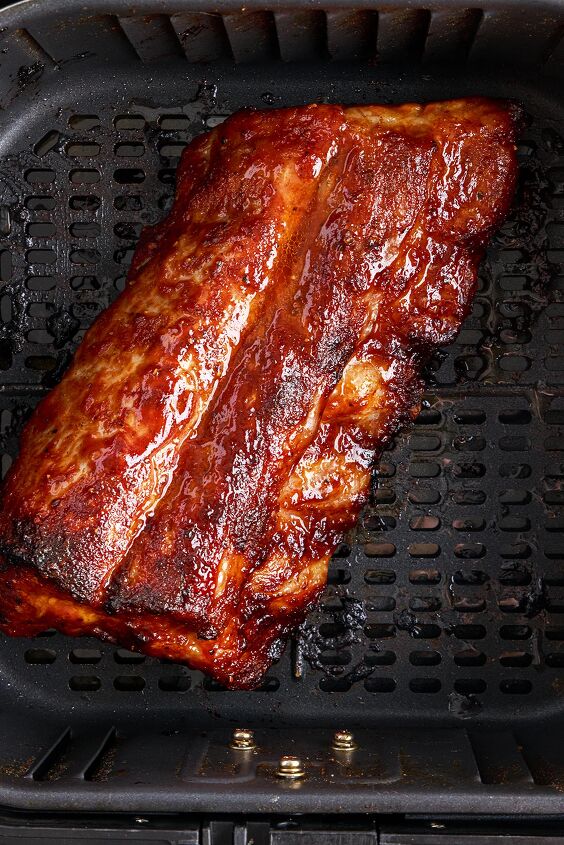 the 20 minute air fryer ribs you ll be craving, slab of cooked bbq ribs in an air fryer basket