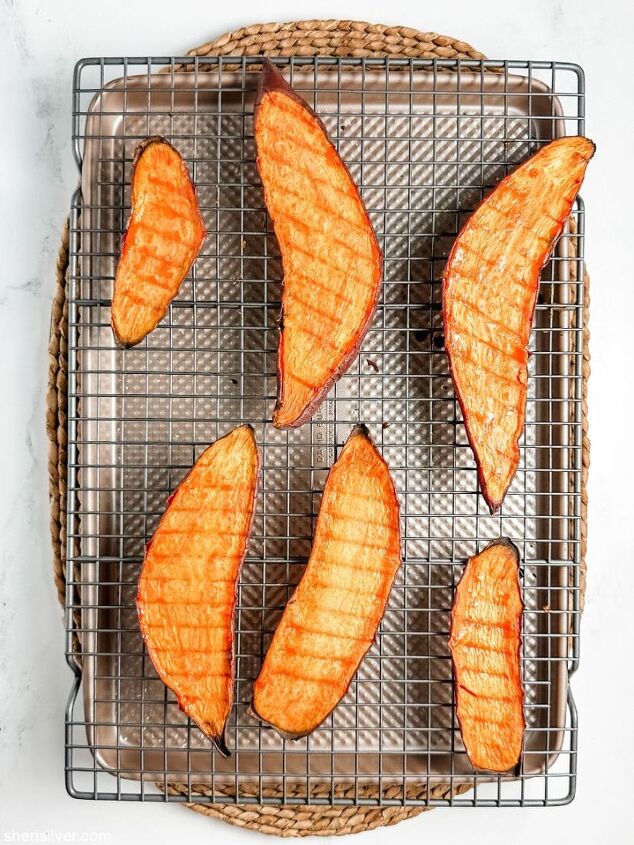 arugula and halloumi tartines on sweet potato toast, roasted sweet potato slices on a wire rack set over a baking sheet