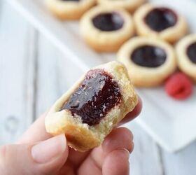 easy raspberry tarts recipe bite sized buttery crunch, Mini raspberry shortbread tarts on a table