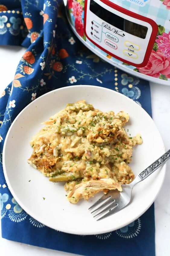 the best slow cooker chicken and stuffing, Plated chicken and stuffing near a floral slow cooker