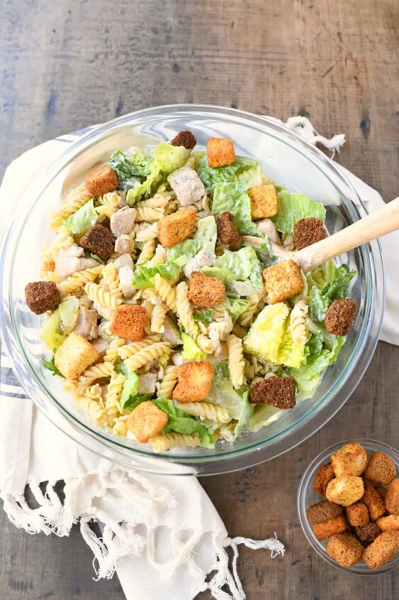 chicken caesar pasta salad, Caesar Pasta salad in a glass bowl with croutons