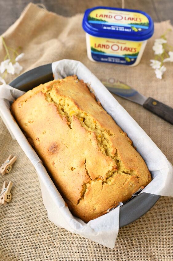 perfectly moist and sweet cornbread with real corn, Real Cornbread Loaf with a tub of butter beside it