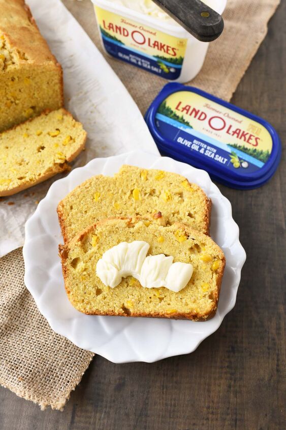 perfectly moist and sweet cornbread with real corn, Buttery sliced cornbread on a white plate