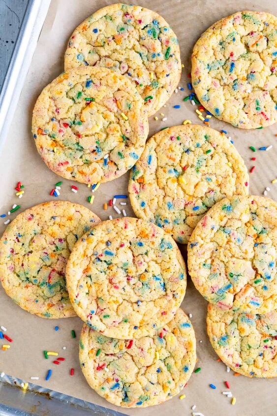 easy funfetti cake mix cookies, Funfetti cookies on a parchment lined baking sheet