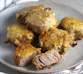 crusted parmesan pork tenderloin, Parmesan Pork Tenderloin pieces on a plate with one cut in half They are juicy salty and slightly cheesy It s easy to make in the oven so you can enjoy it at home anytime