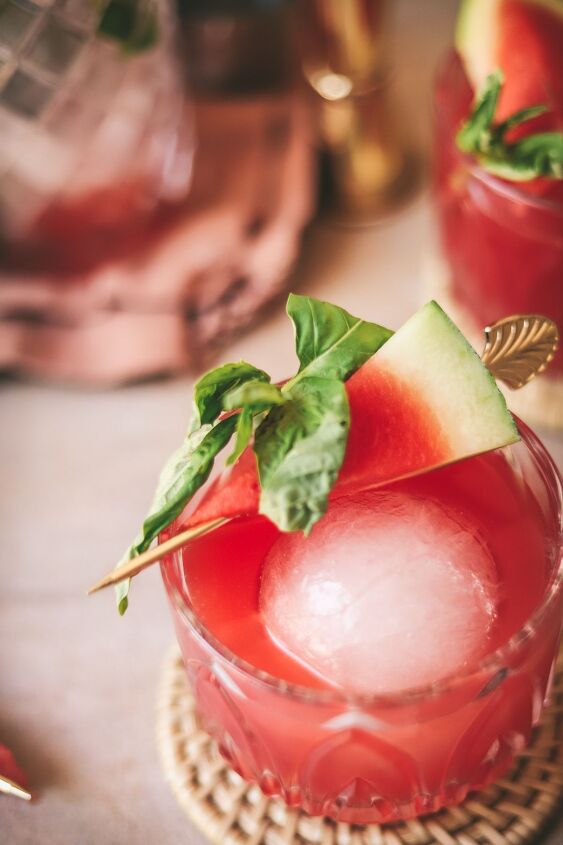 fresh watermelon vodka cocktail with basil, Watermelon vodka and basil drink in a glass with garnish