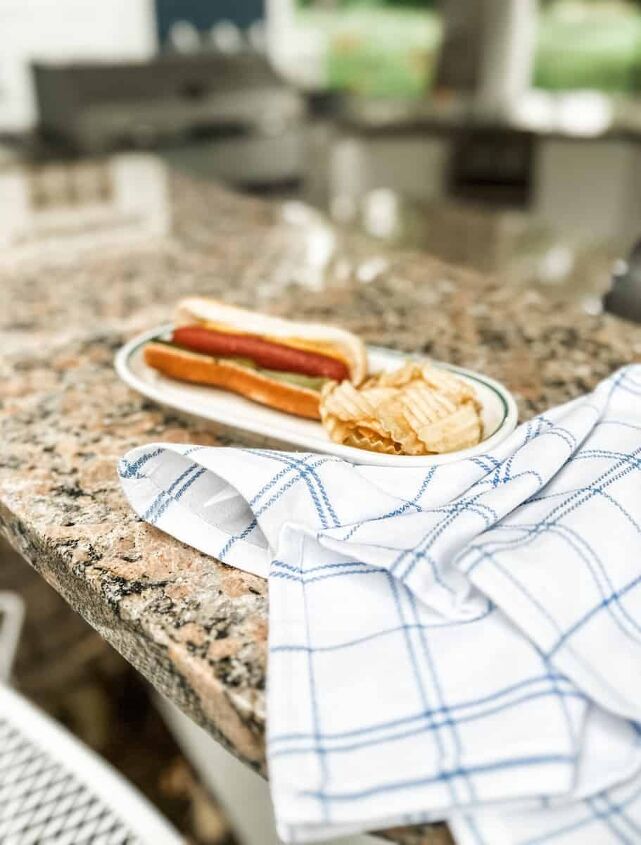 create a gourmet hot dog bar for your next summer party, a hot dog on a regular hot dog bun with mustard pickles and celery salt which are my favorite toppings from the gourmet hot dog bar