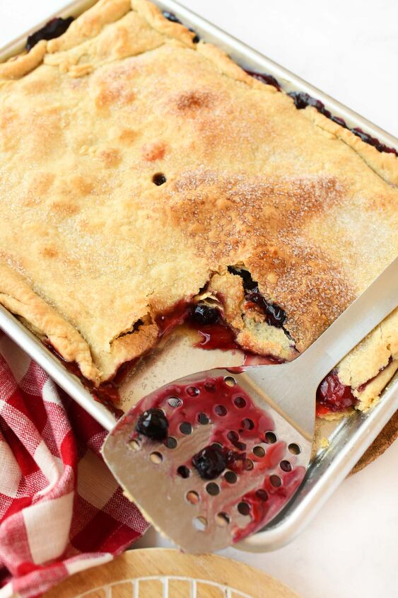 cherry blueberry slab pie a crowd pleasing dessert, Berry stained spatula near a sheet pan pie
