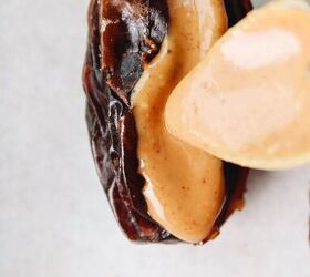 peanut butter stuffed dates, date being filled with peanut butter
