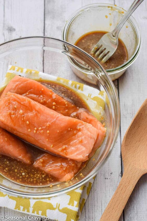 baked teriyaki salmon, baked teriyaki salmon recipe and marinade in bowl on the side