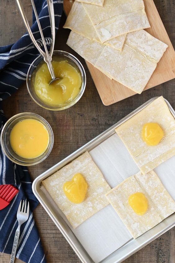 iced lemon turnovers, Puff pastry dough squares with filling in the center of each