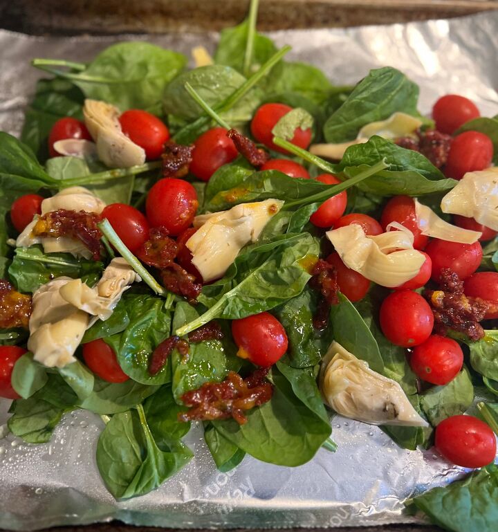 what do you do with leftover champagne, A bed of Spinach Artichokes and sundried tomatoes and grape tomatoes on a sheet of foil