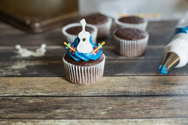 adorable disney pixar coco inspired guitar cupcakes recipe with printa, Chocolate cupcake topped with a guitar