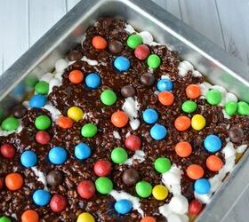 chocolate crispy fluff caramel cookie bar recipe, Cookie bar with candy layers in a baking pan