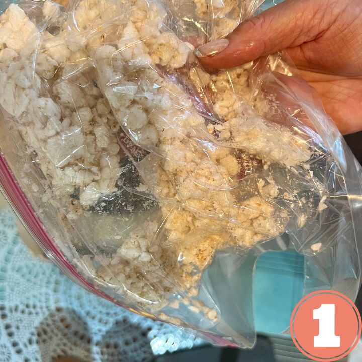 jumbo rice cake almond butter cookie, a hand holding a ziplock bag with a crumbled rice cake in it