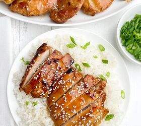 oven baked teriyaki chicken thighs boneless or bone in, sliced oven baked teriyaki chicken with green onions and sesame seeds on a bed of rice
