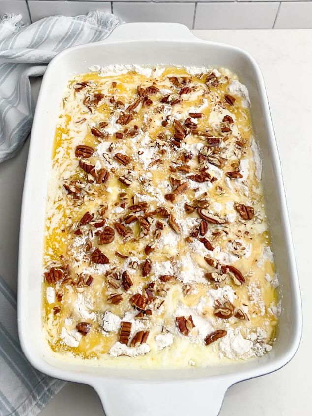 the best pineapple dump cake super easy, cake mix melted butter and pecans over pineapple filling in a white baking dish