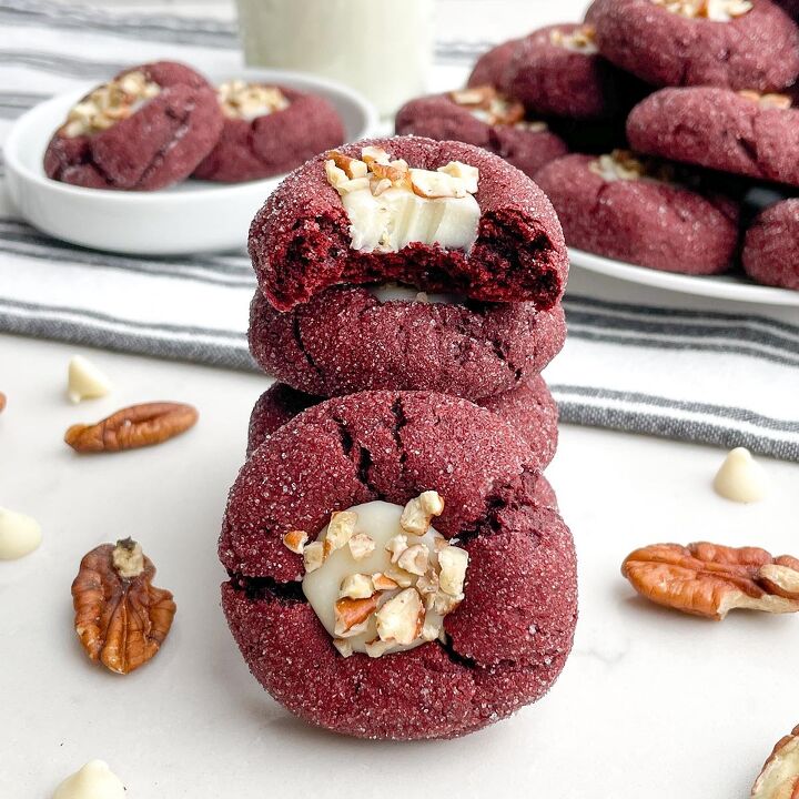 the best pineapple dump cake super easy, stack of red velvet cake mix cookies with a bite taken out of the top one and plates of cookies in the background