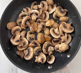 red robin inspired mushroom swiss burger recipe, Mushrooms in a skillet with garlic butter