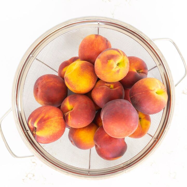 Colander of fresh peaches