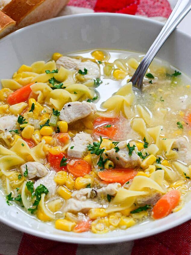 creamy mexican bean soup with corn, Chicken vegetable soup in a white bowl
