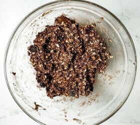 no bake chocolate granola bars vegan gluten free, chocolate granola bar batter in a glass mixing bowl