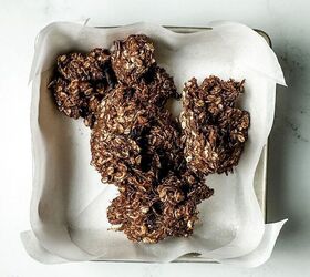 no bake chocolate granola bars vegan gluten free, chocolate granola bar batter in a parchment lined baking pan