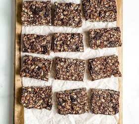 no bake chocolate granola bars vegan gluten free, chocolate granola bars on a parchment lined wooden board