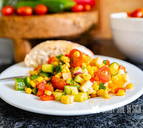 the best homemade pico recipe, Easy corn salad recipe on a white plate with a roll