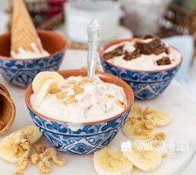 Peanut Butter Banana homemade ice cream topped with chopped nuts and sliced bananas in a blue and white bowl