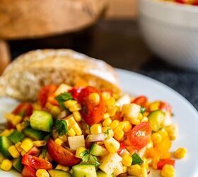 Easy corn salad recipe on a white plate with a roll