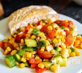 Easy corn salad recipe on a white plate with a roll