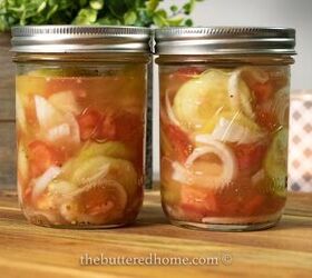 fresh cucumber tomato and onion summer salad, two jars of summer salad