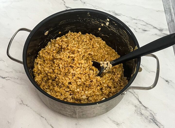 peanut butter rice krispie bars, rice krispie mixture in a pan