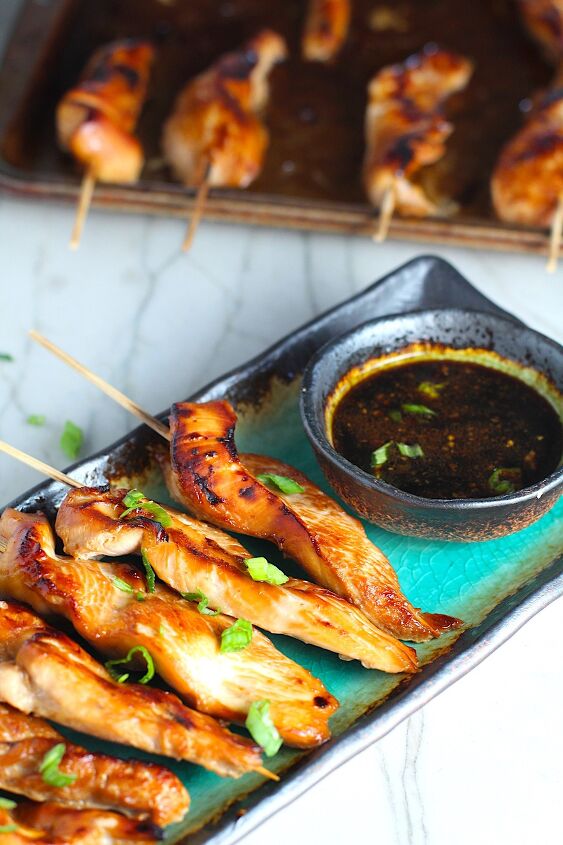 chinese chicken on a stick recipe garlic sesame sauce, Chinese Chicken on a Stick Recipe on a rectangle platter with small bowl of dipping sauce and pan in background