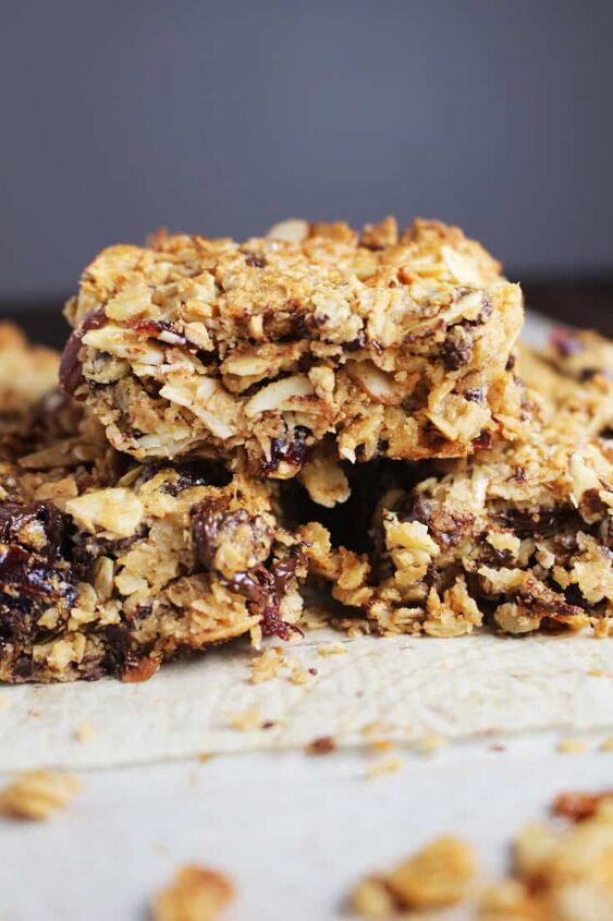 chewy granola bars, Chewy granola bars stacked on a sheet of parchment paper