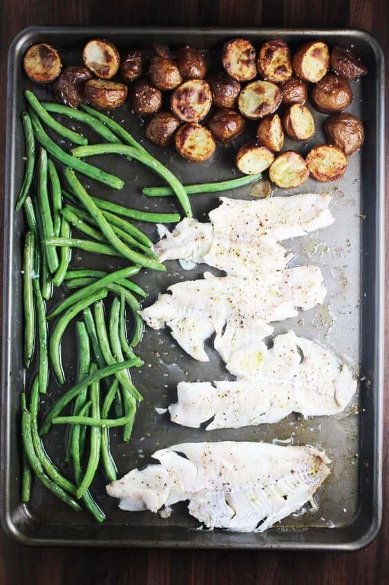 sheet pan dinner with fish and brown butter sauce, White fish green beans and potatoes on a sheet pan for sheet pan dinner