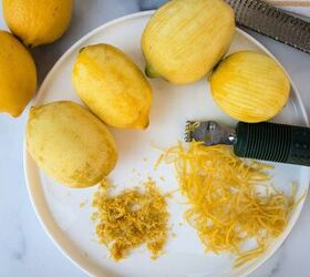 how to make lemon sugar to flavor desserts and drinks, A white plate with two types of lemon zest with a citrus zester and lemons