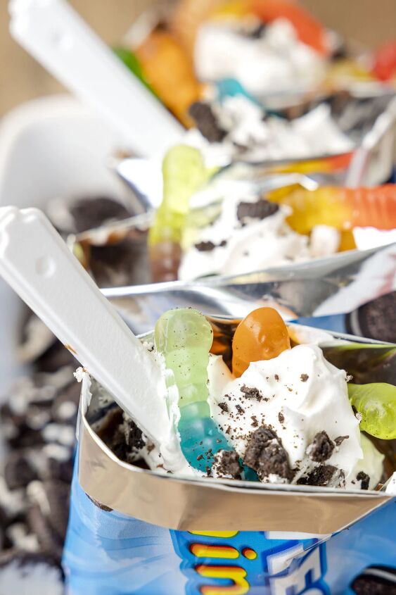 make everyone happy with this walking cup of dirt dessert, up close angled down view of walking oreo desserts with spoons