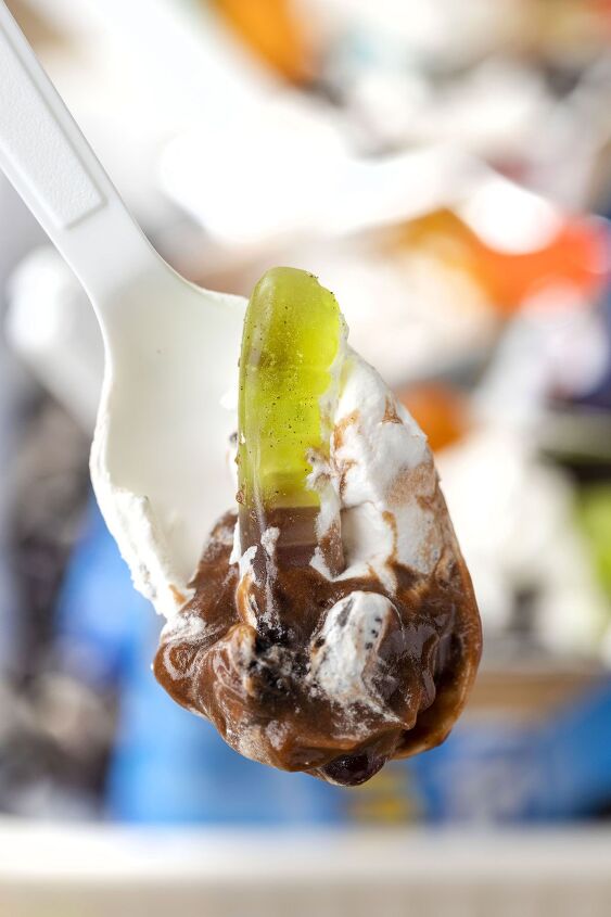 make everyone happy with this walking cup of dirt dessert, up close view of spoon with gummy worm chocolate pudding crushed oreo and whipped topping
