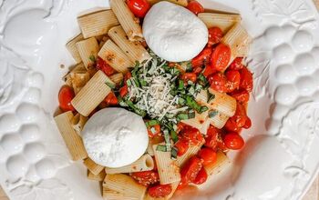 Pasta With Burst Cherry Tomatoes Topped With Burrata Cheese
