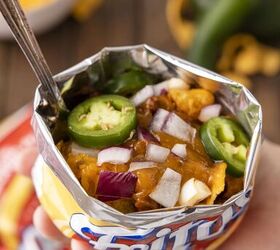 no plate needed when you make walking frito pie, view inside of frito walking pie chip bag including jalape o red onions cheese and beef