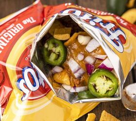 no plate needed when you make walking frito pie, pie of fritos pie bags filled with walking taco frito pie ingredients