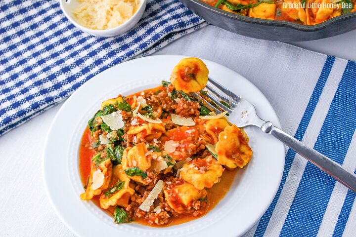 italian sausage tortellini skillet, Sausage Tortellini on a round white plate with a fork