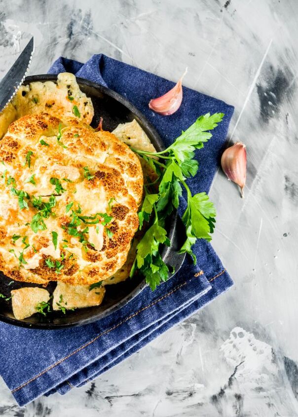 do you hate cauliflower, Roasted Cauliflower in a cast iron skillet plated on on jeans