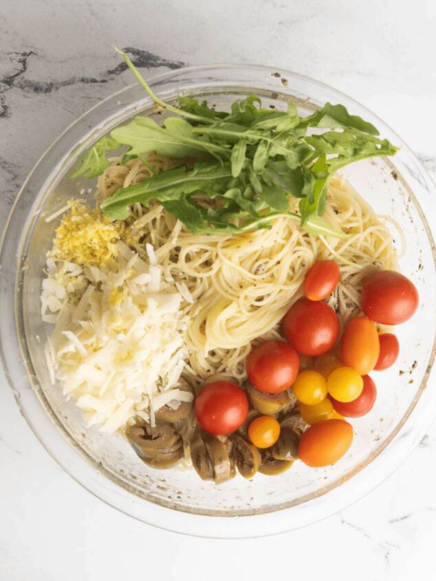 cold lemon capellini salad with arugula angel hair pasta, All the ingredients for Lemon Capellini Salad in a bowl before mixing