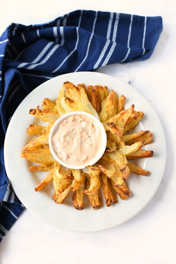 make an air fryer onion blossom at home, A crispy golden brown blooming onion at home