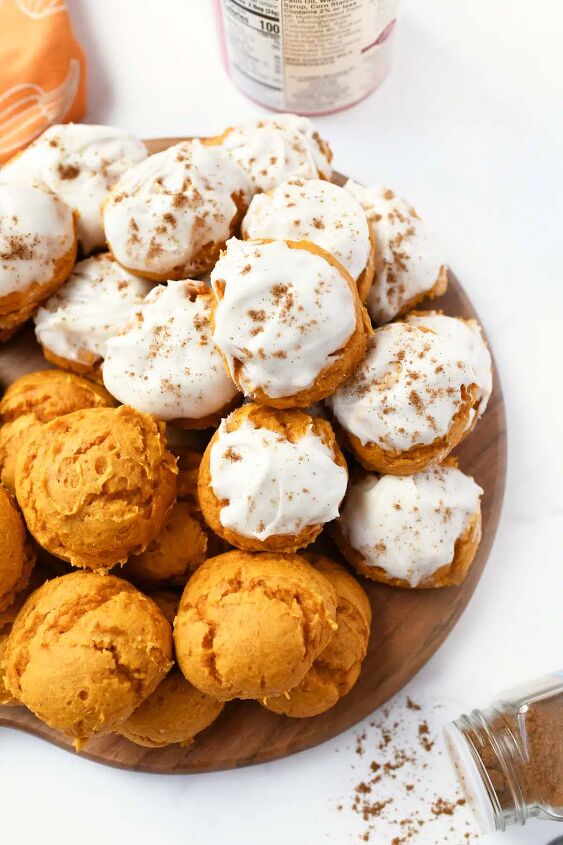 pumpkin spice cake mix cookies, Iced pumpkin cookies on a wooden tray