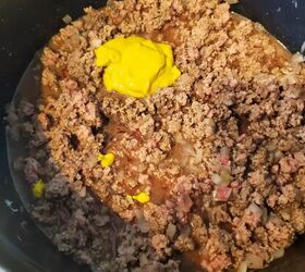 dutch oven crumbly burger maid rite style loose meat sandwich, Mustard being added to a Dutch oven of meat for Maid Rite Sandwiches